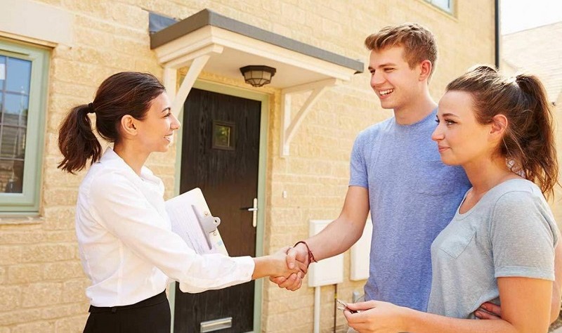 a tenent couple discussing something with their landlord