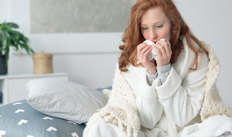 a woman suffering from allergy