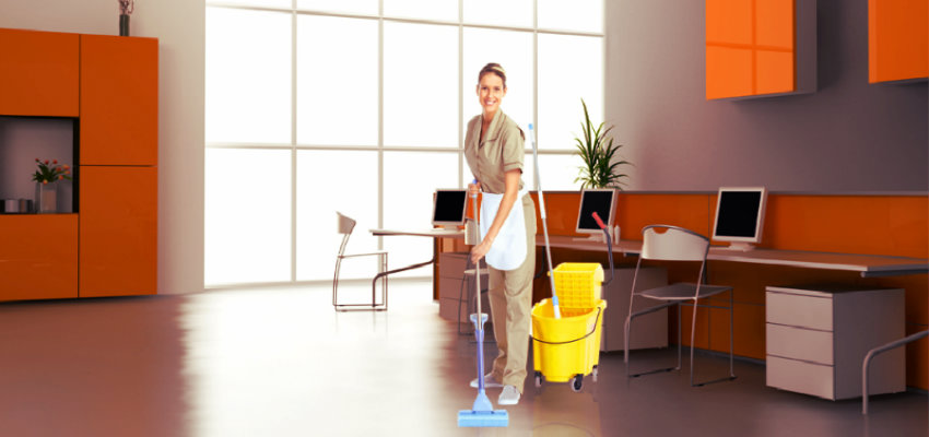 lady mopping the floor of an office
