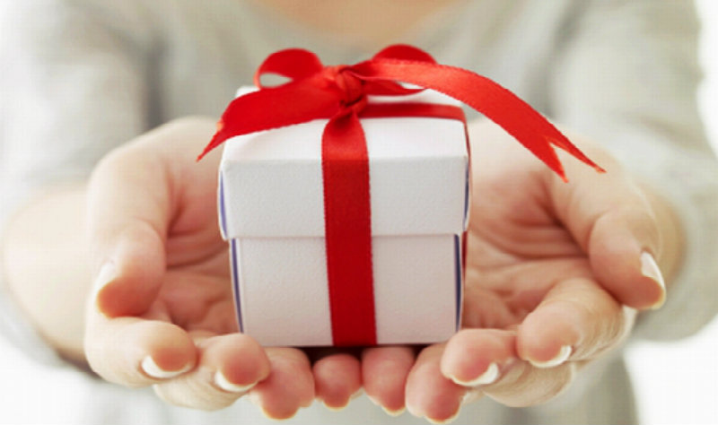 beautiful hands holding a gift