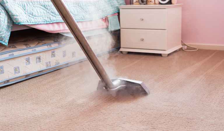 Warm Water Carpet Cleaning inside a bedroom.