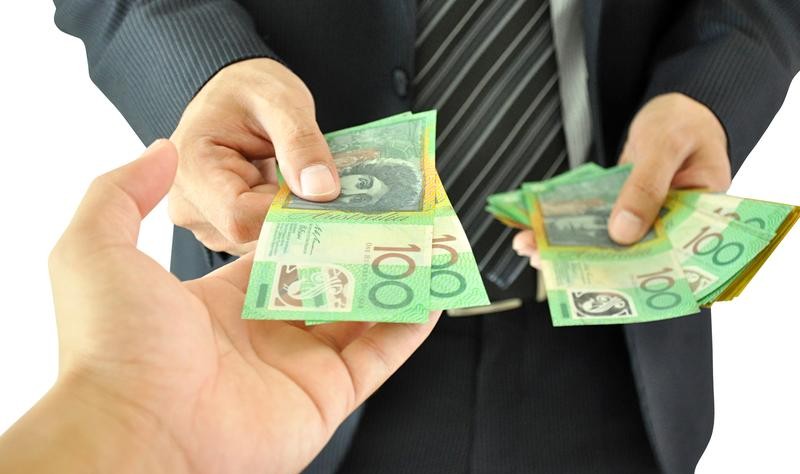 cropped picture of two people exchanging the money