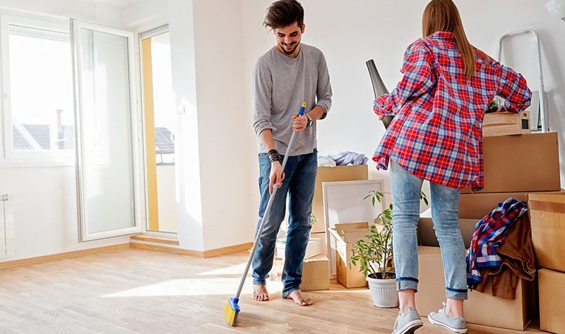 young couple sprucing up their new house