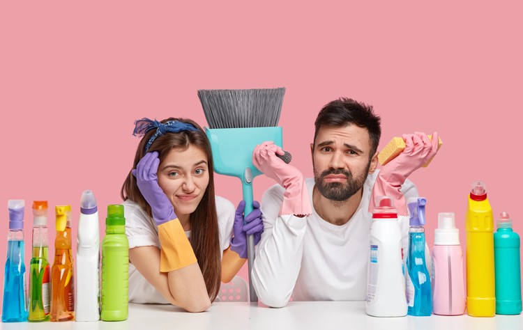 worried couple with some chemicals and disinfectants