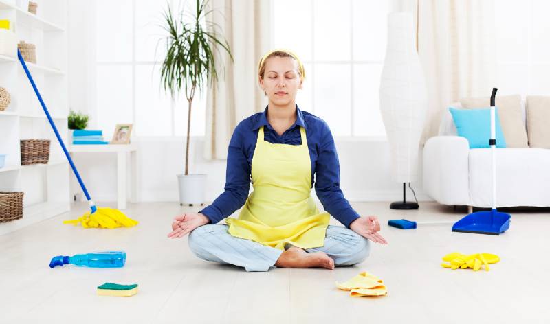 Woman is doing meditation inside a room