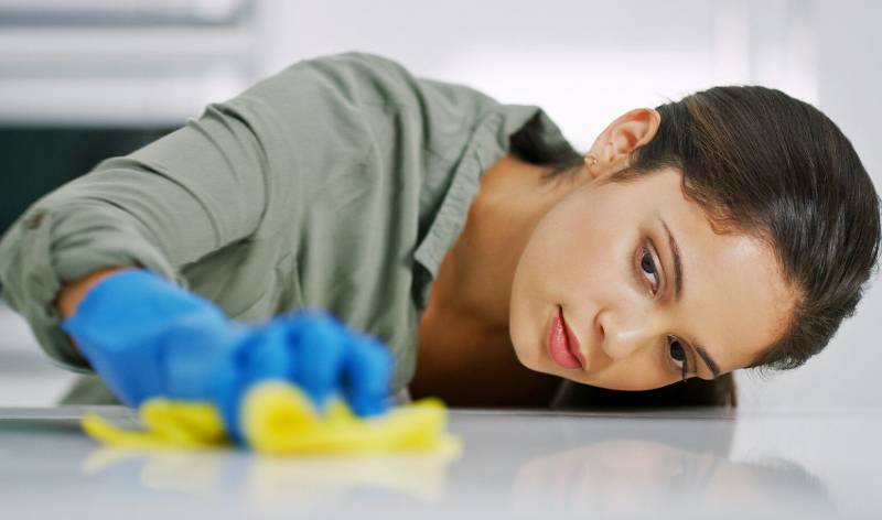 Women cleaning with tools