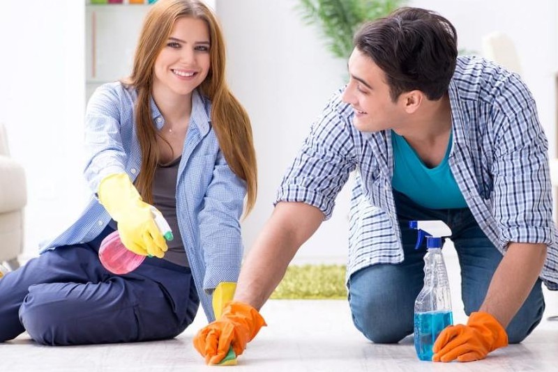 young couple preparing their rental house for the final inspection