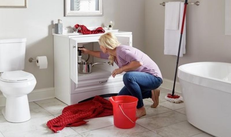 young woman cluttering her bathroom