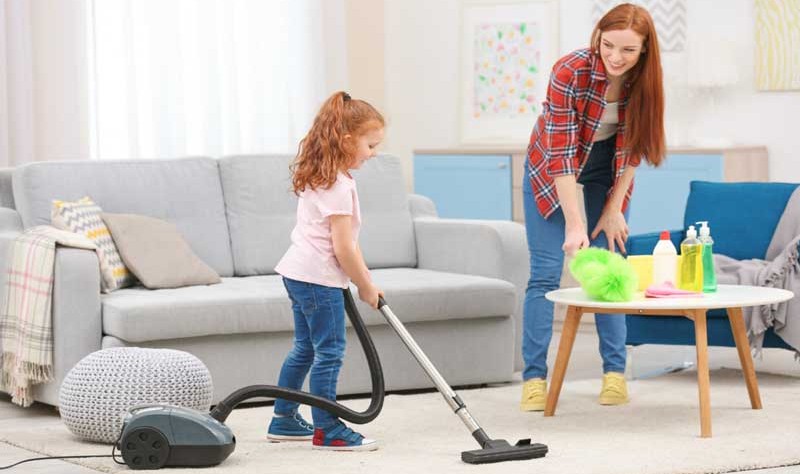 A young mother and her daughter sprucing up their house