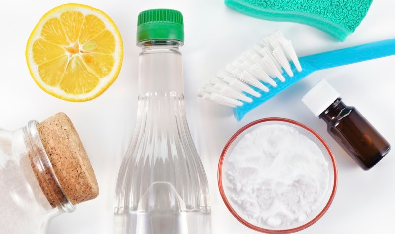 lemon, cleaning brush, baking soda, sponge