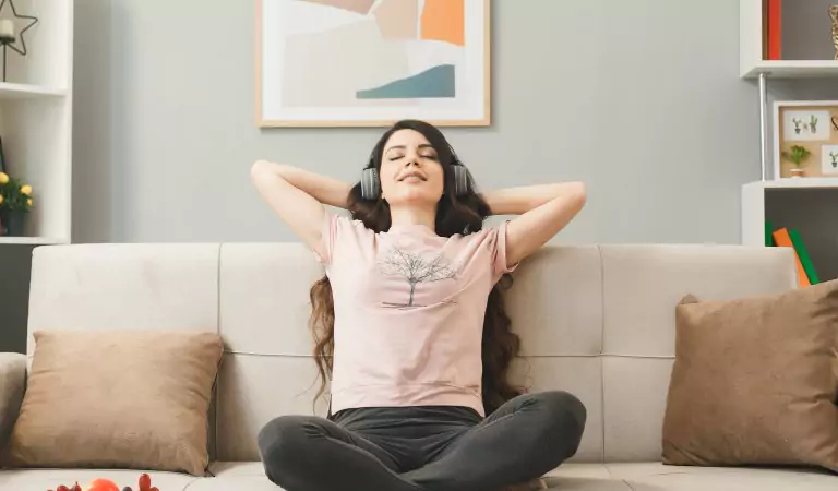 young woman sitting relaxed inside of a house