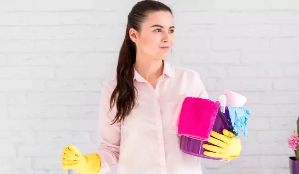 woman with some cleaning products ready to clean