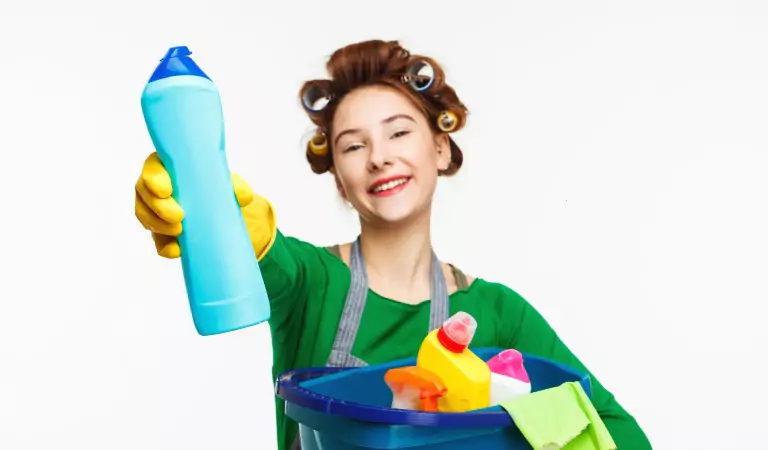young woman ready with cleaning essentials ready to clean