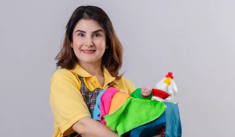 woman with some cleaning products ready to clean