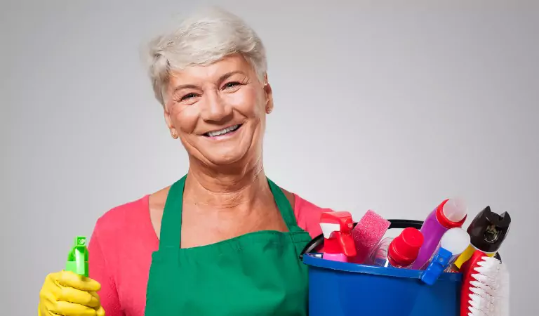 old age woman with a cleaning caddy