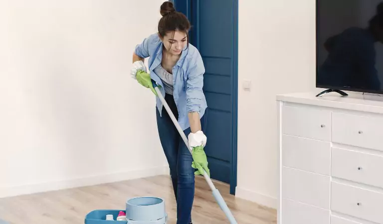 woman sprucing up her room