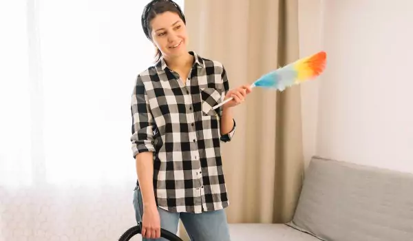 woman during the house cleaning process