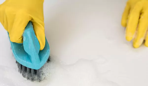 cropped picture of a person cleaning a stain